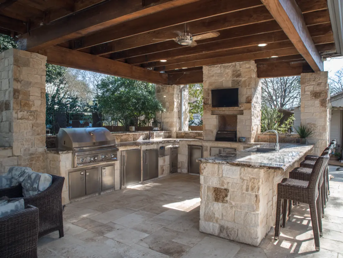 Outdoor living space renovation with covered patio and outdoor kitchen by Austin contractors